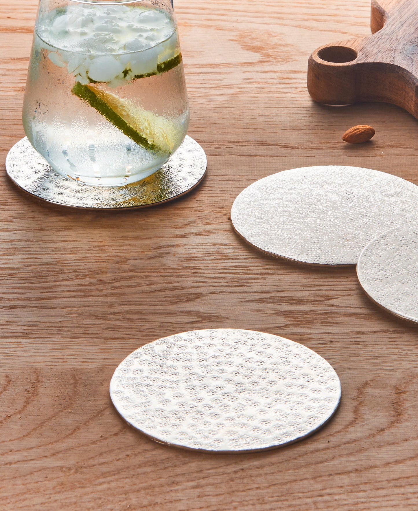 Set of 4 Silver Round Metal Coasters for Sleek Surface Protection