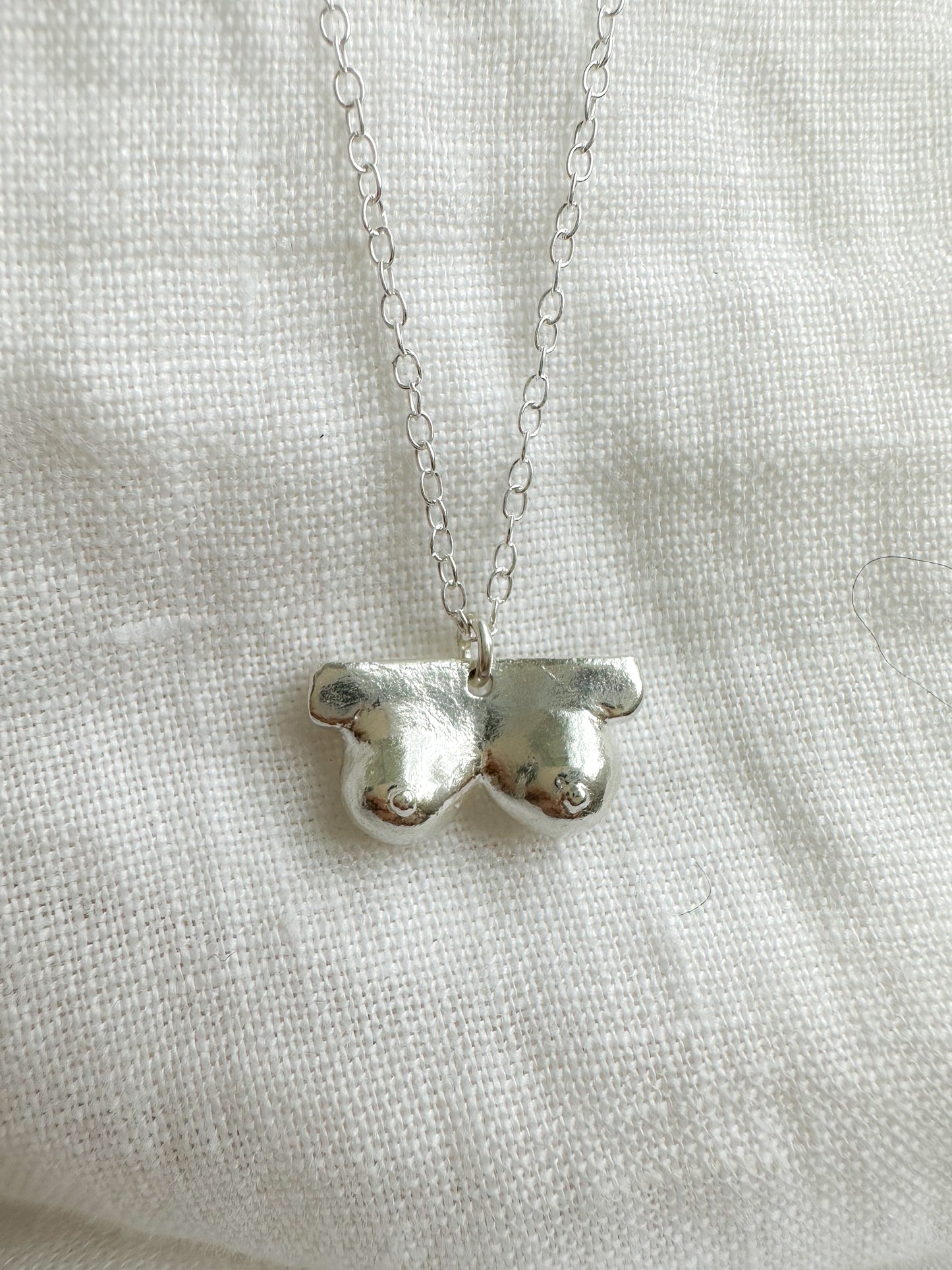 Boob necklace sterling silver breast necklace, hand-carved in Maine, adjustable chain, recycled silver