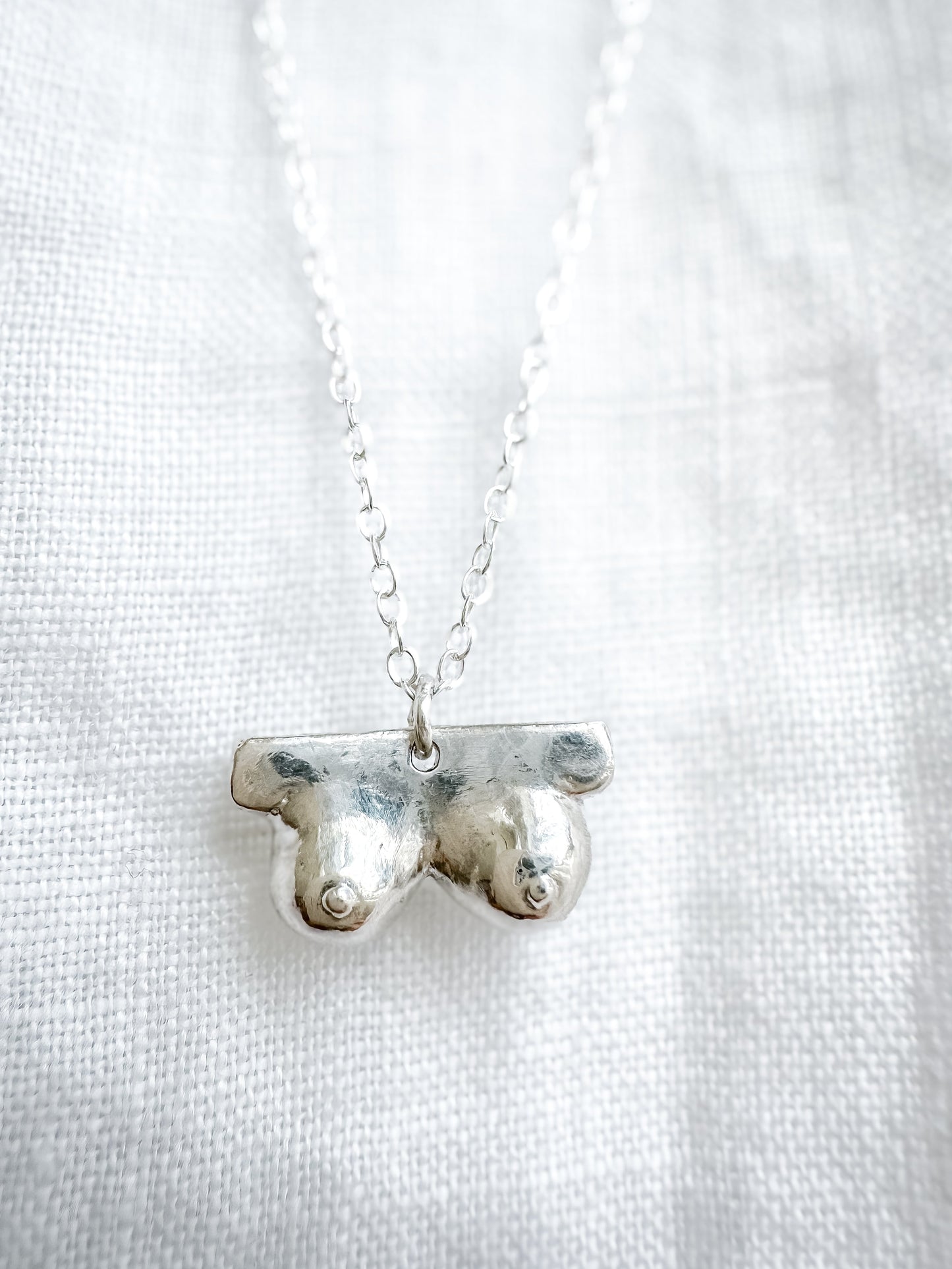 Boob necklace sterling silver breast necklace, hand-carved in Maine, adjustable chain, recycled silver